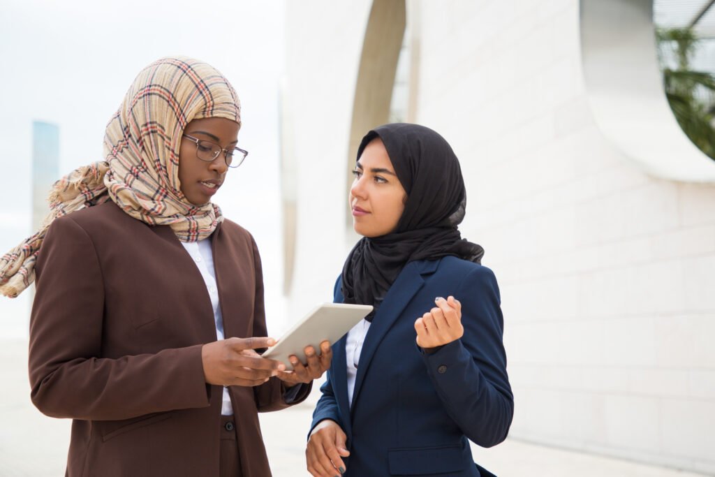 Focused Muslim business woman explaining project specifics